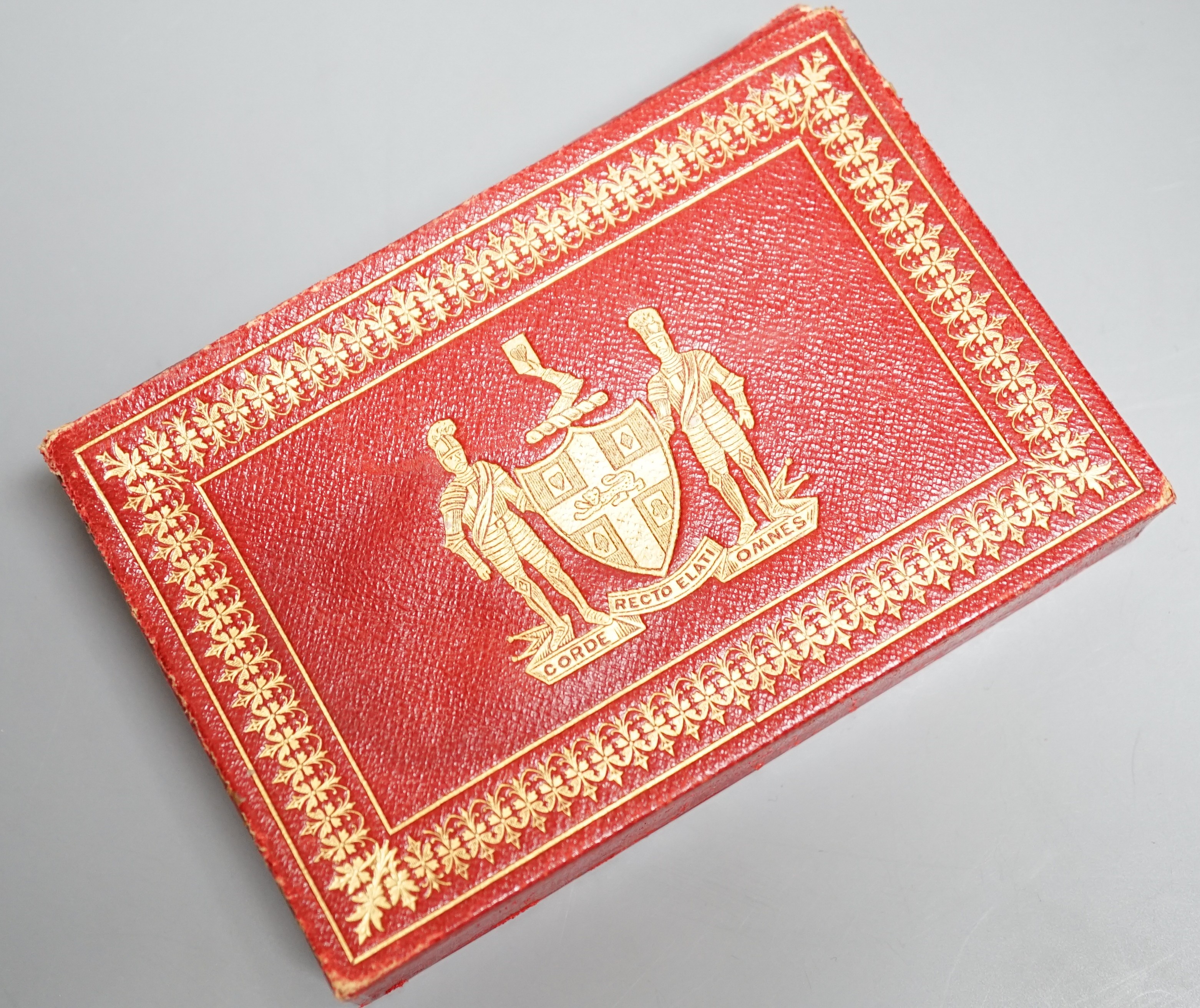 Two packs of Edwardian Royal commemorative playing cards with red morocco leather case, gilt decorated with an armorial